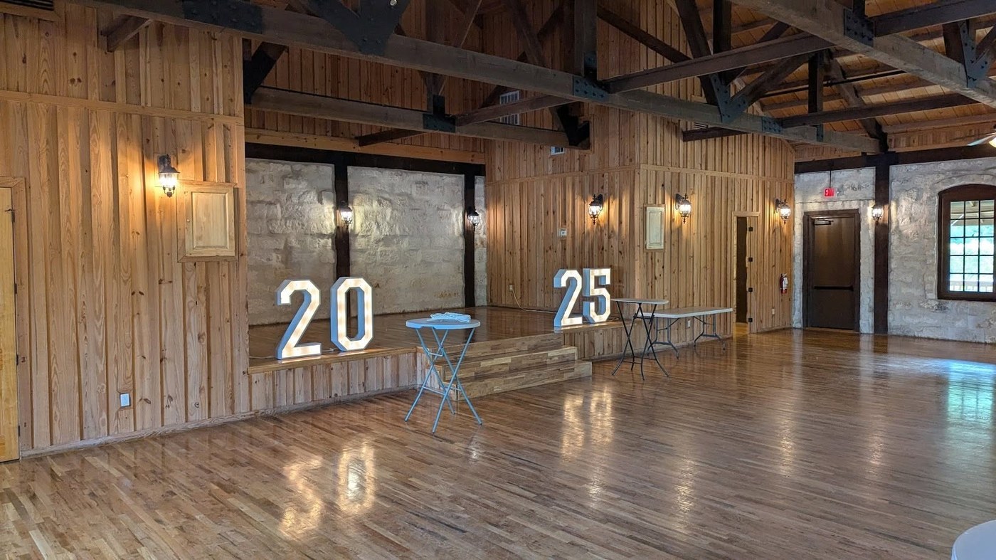 Marquee numbers 20 and 25 installed at a rustic barn event venue